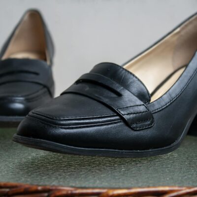 Close-up of stylish black leather women's loafers, perfect for fashion-forward styling.